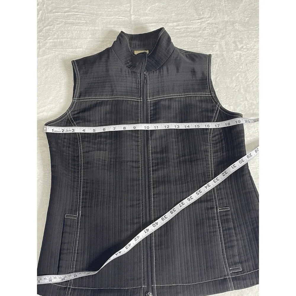 Chico's Vest Size 1 Zip up front pockets on front Black With White Stitching‎